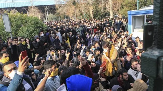 In this photo taken by an individual not employed by the Associated Press and obtained by the AP outside Iran, university students attend a protest inside Tehran University while anti-riot Iranian police prevent them to join other protestors, in Tehran, Iran, Saturday, Dec. 30, 2017. A wave of spontaneous protests over Iran's weak economy swept into Tehran on Saturday, with college students and others chanting against the government just hours after hard-liners held their own rally in support of the Islamic Republic's clerical establishment. (ANSA/AP Photo) [CopyrightNotice: Copyright 2017 The Associated Press. All rights reserved.]